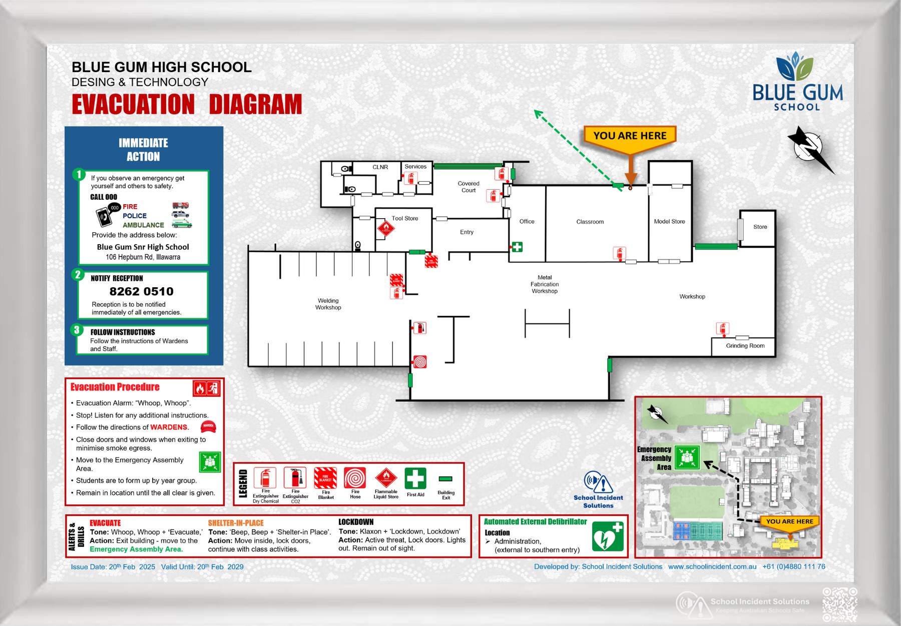 Example school evacuation diagram displayed in a silver clip frame, showing evacuation routes, emergency equipment, alarm information and assembly areas